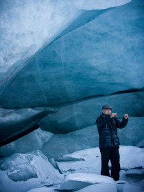 Ryuichi Sakamoto recording sound at the mouth of Sermeg Avangnardleq Glacier during the 2008 Disko Bay expedition. Photo by Nathan Gallagher.